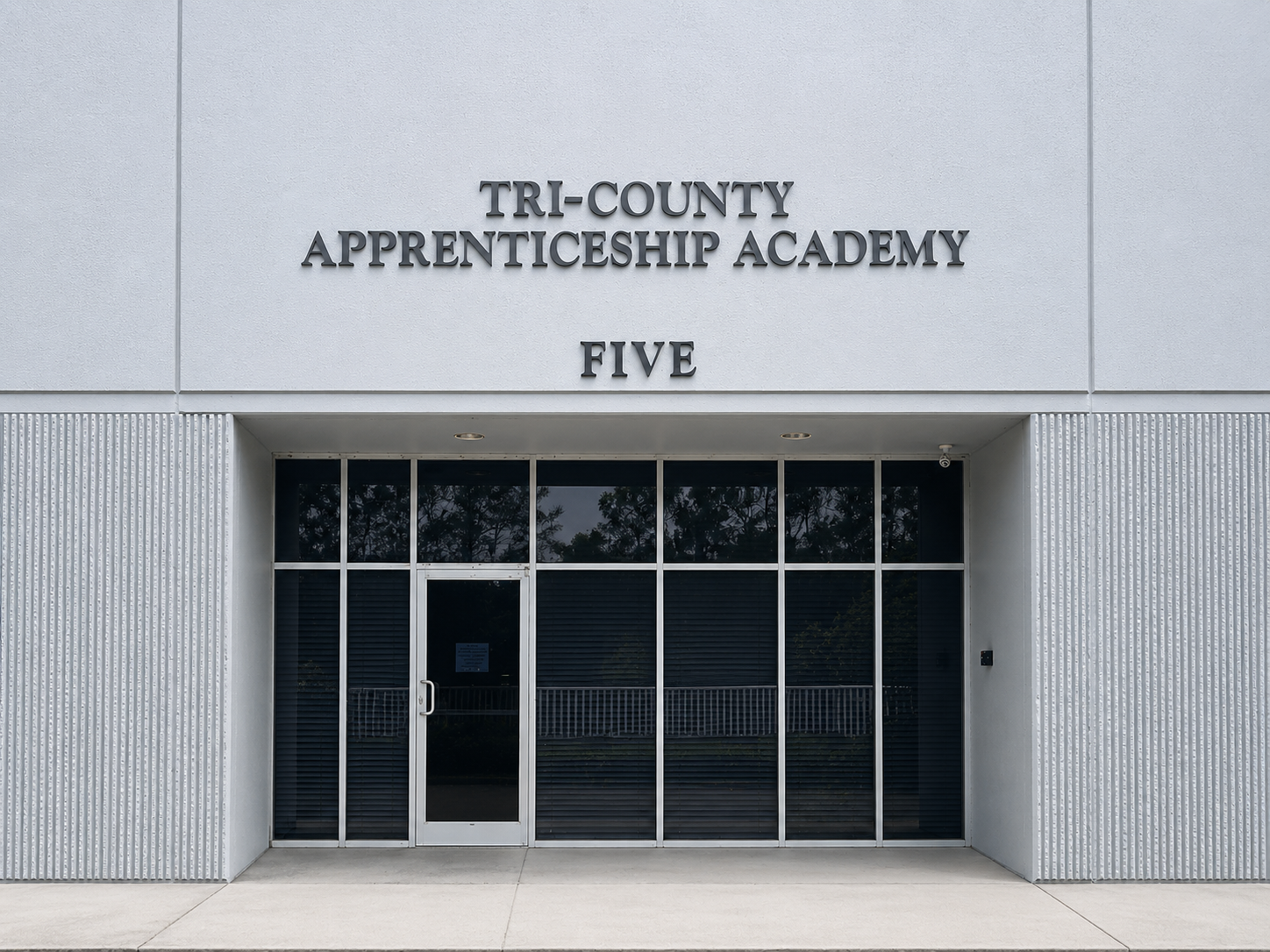 Exterior view of the training facility building and parking area